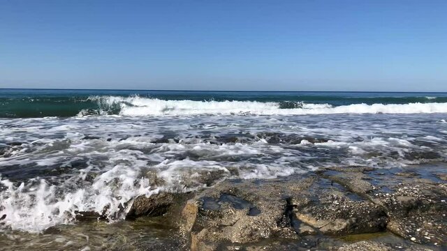 Sea waves on the rocky beach of Alanya