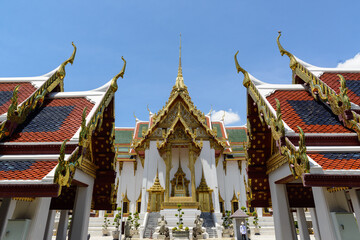 Dusit Maha Prasat Throne Hall, was built on a symmetrical cruciform plan, the roof is topped with a tall gilded spire, located at The Grand Palace, Bangkok, Thailand.