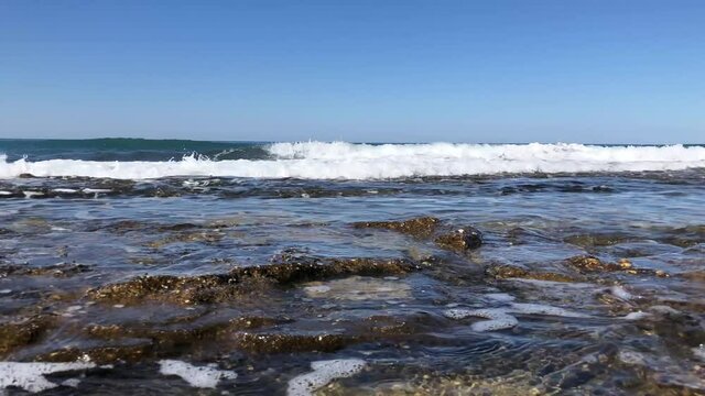 Sea waves on the rocky beach of Alanya