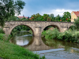 Fototapeta na wymiar Old bridge over the river
