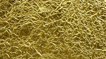 gold foil background with shiny crumpled surface for texture background
