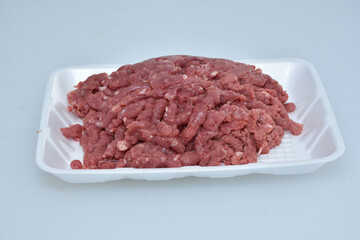 fresh organic mutton mince meat decorated in plate on white background