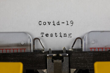 written on old typewriter with text Covid-19 Testing. Covid-19, Coronavirus concept