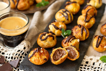 French dessert choux pastry balls filled with chocolate custard cream