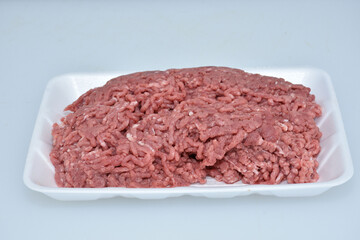 fresh organic mutton mince meat decorated in plate on white background