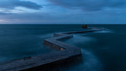 Waves in the sell around St Monans zigzag breakwater as the sun begins to rise.