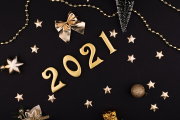 Happy New Year 2021. Sparkling gold numbers on black background with stars. object for design...