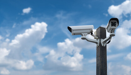 Outdoor Security CCTV cameras on blue sky background .