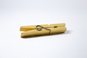 Clothespin made of wood on a white background