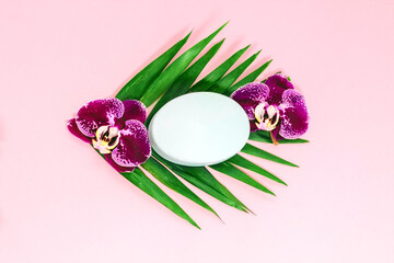 Fototapeta na wymiar Purple orchid with soap on a pink background. Space for text.