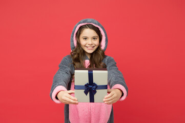 Choosing the best. teen girl enjoy boxing day. happy childhood. shopping gift for holiday. christmas or new year. cute kid in fluffy rabbit pajama hold present box. cheerful child celebrate birthday