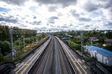 Fototapeta premium railway tracks and an overpass through them