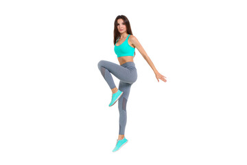 Fototapeta na wymiar Woman in sportswear doing exercises on the body warm up jogging 