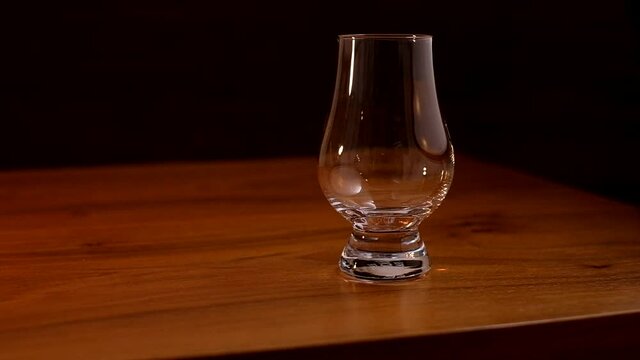 Pouring scotch single malt whisky in a glencairn glass