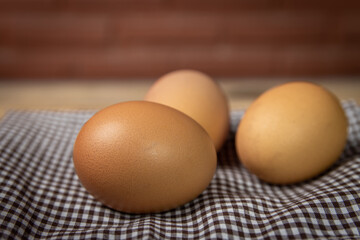fresh chicken eggs on a old wooden table