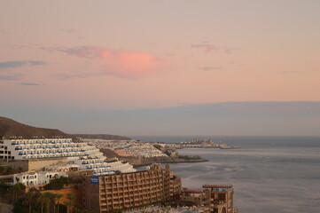 Sunset over Playa Amadores beach on Gran Canaria in Spain
