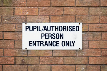 Fototapeta na wymiar School pupil authorised person entrance only sign