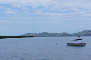 Boat on the roadstead in the bay near the town of Nadi on the island of Viti Levu in the archipelago of Fiji