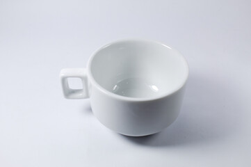 White cup of coffee or tea on a white background