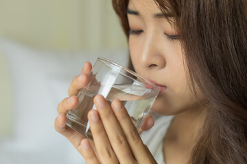 Asian women drinking fresh water