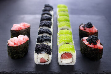 gunkan and maki sushi set decorated with caviar © Vadym