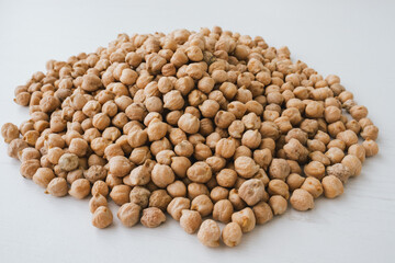 Fresh chickpea on bright wooden background.