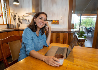 Happy successful young woman on laptop working from home in Coronavirus and New normal concept