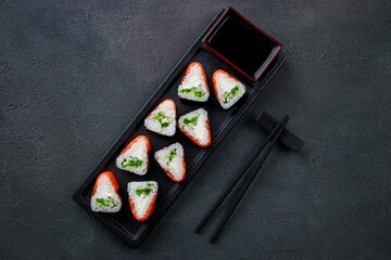 Seafood delicatessen salmon sushi rolls on plate