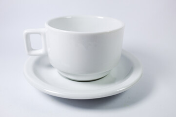 White cup of coffee or tea on a white background