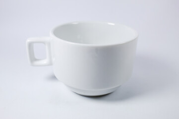 White cup of coffee or tea on a white background