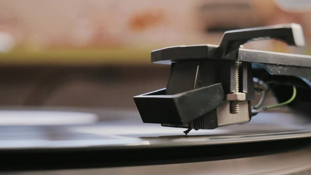 Cinemagraph vinyl record is spinning. Old retro turntable.turntable stylus on a record