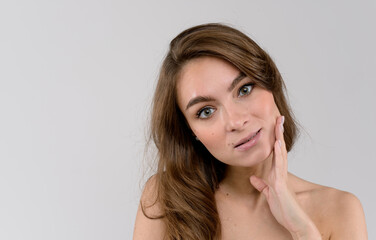 Portrait of a sensual young woman. Close up portrait over white background