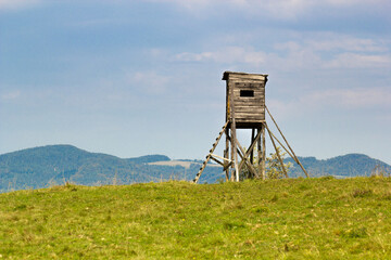 Naklejka premium Wooden elevated hunting blind in Beskids Mountains in summer