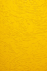 Yellow decorative plaster texture bark beetle close up.