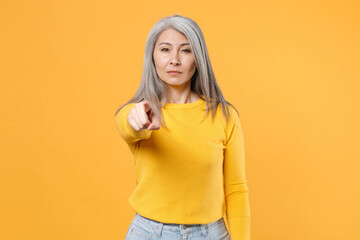 Dissatisfied displeased concerned strict gray-haired asian woman wearing casual clothes standing...