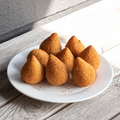 Coxinhas, brazilian snacks party food, nicely served in a plate