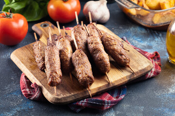 Grilled balkan cevapcici or  kebab on skewers