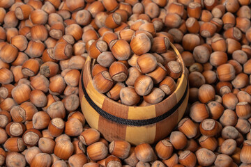 Filtered image of Hazelnuts in a wooden bowl