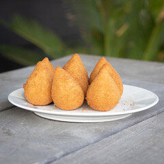 Coxinhas, brazilian snacks party food, nicely served in a plate