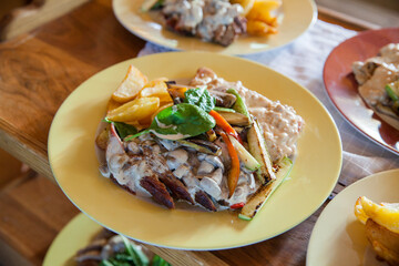 Tasty food serving in restaurant, vegetable with pork meat.