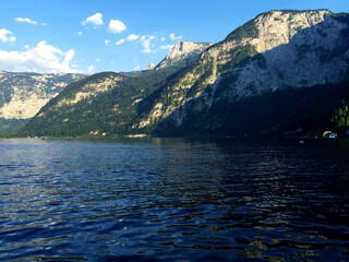 landscape of lake and mountains against blue sky at sunny day in Hallstatt Upper Austria