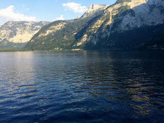 landscape of lake and mountains against blue sky at sunny day in Hallstatt Upper Austria