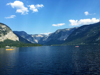 landscape of lake and mountains against blue sky at sunny day in Hallstatt Upper Austria