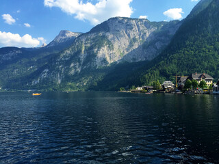 landscape of lake and mountains against blue sky at sunny day in Hallstatt Upper Austria