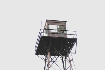 CHOPPED IMAGE OF WATCH TOWER, BACKGROUND SKY, METAL AND WOOD