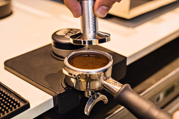 close up of ground coffee bean in coffee brewed machine