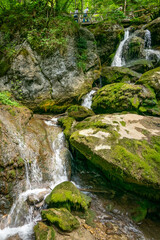 Naklejka na ściany i meble Wooden walking bridges and majestic waterfalls in water land of Myra Valley. Lower Austria, 9th July 2020.