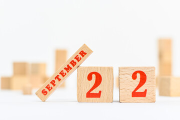 22nd of September on the wooden calendar blocks on white background.