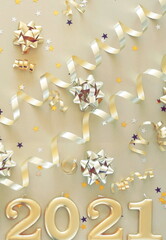 Happy new year 2021 decorations in gold colors on gold background. Top view. Christmas card.