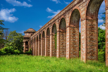 Ancient architecture in Tuscany. The stone temple-cistern of Lucca old aqueduct ruins built in neoclassical style in 1823